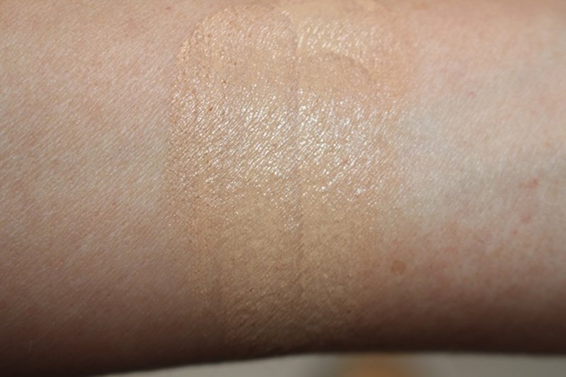Close-up of creamy balm texture in white pot