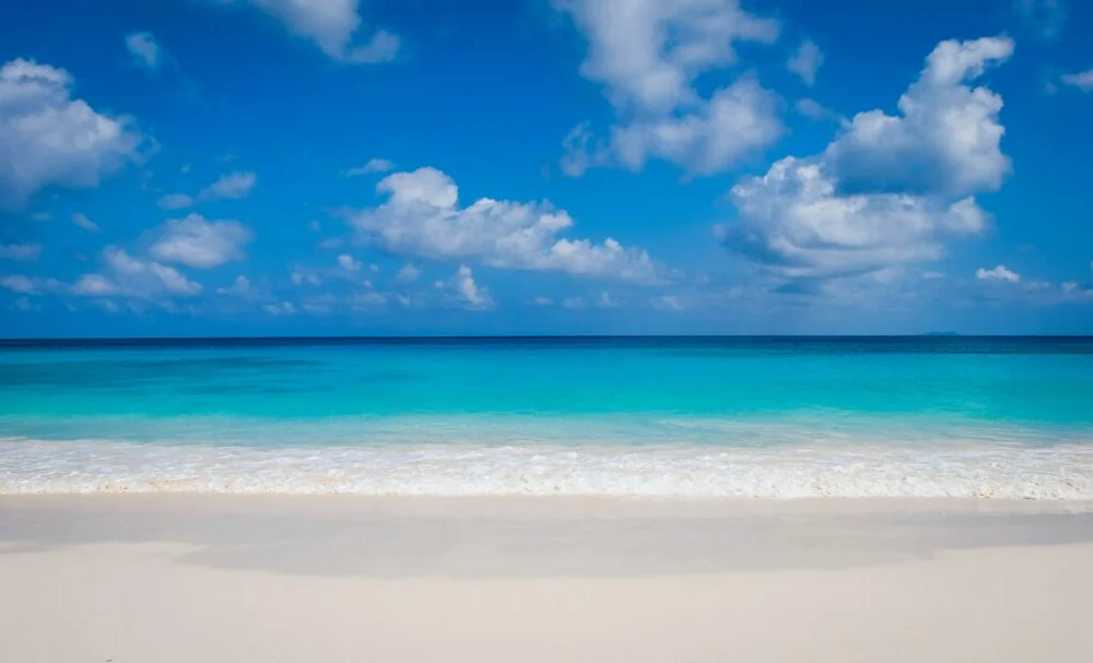 Waves rolling onto the sand at a quiet beach