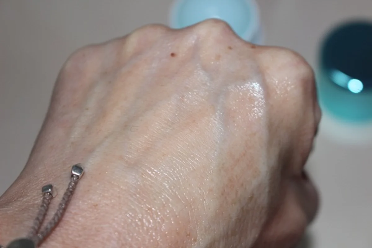 Hand holding RoC Hydra+ Hyaluronic Serum Stick