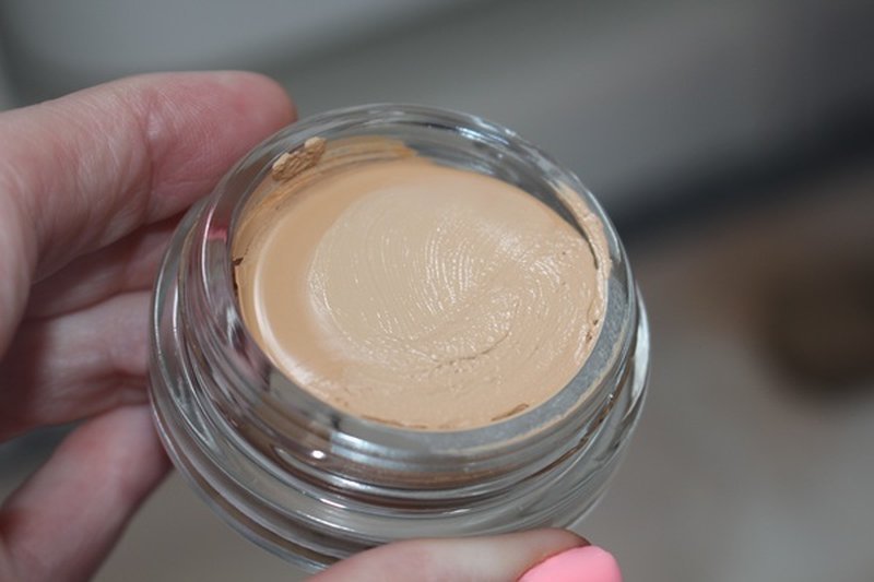 Glowing dewy finish on natural skin after balm application