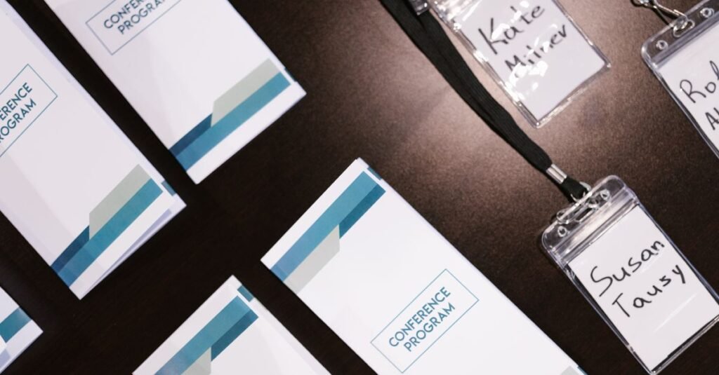 Name badges and conference programs on an event table