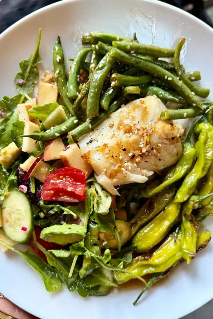 Miso cod with green beans, arugula salad, and shishito peppers