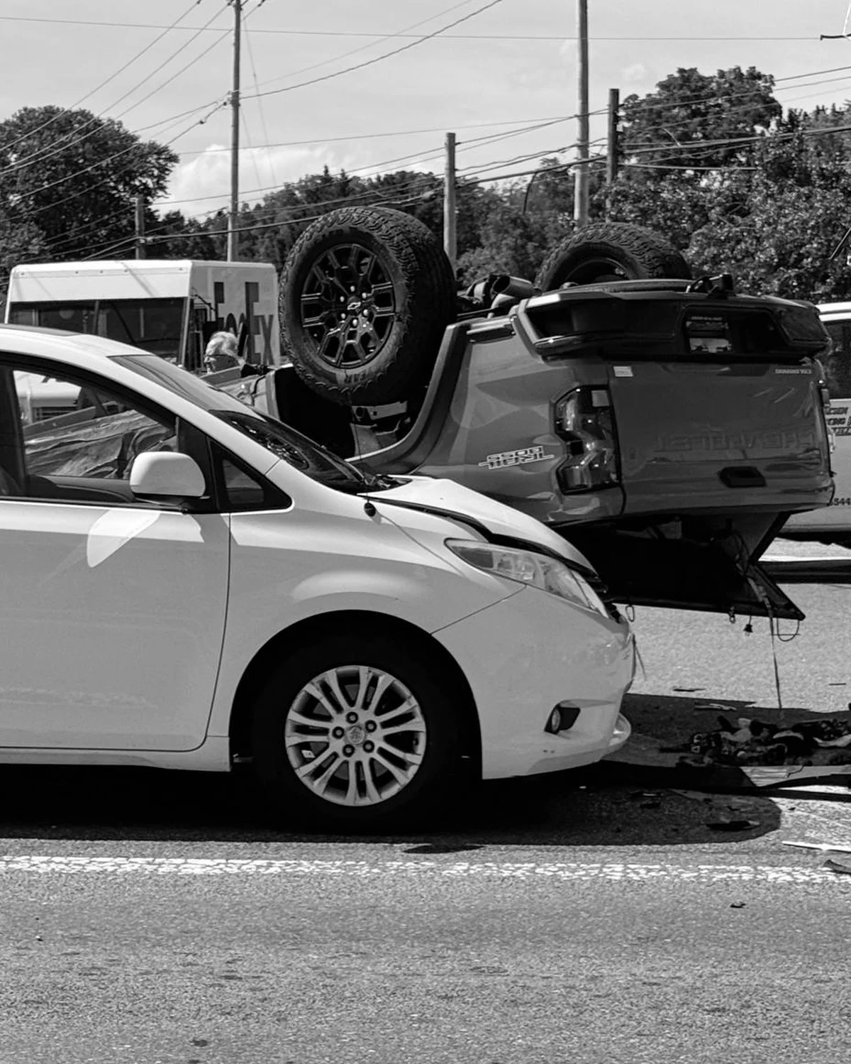 Flipped pickup truck after intersection collision with minivan