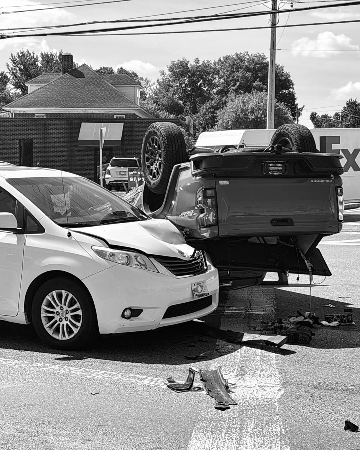 Damaged Toyota minivan and pickup truck at accident scene